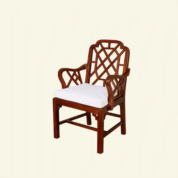 Ashford Chippendale Armchair – Angled Profile View Angled profile of Ashford Chippendale Armchair with curved wood arms and tailored seat cushion