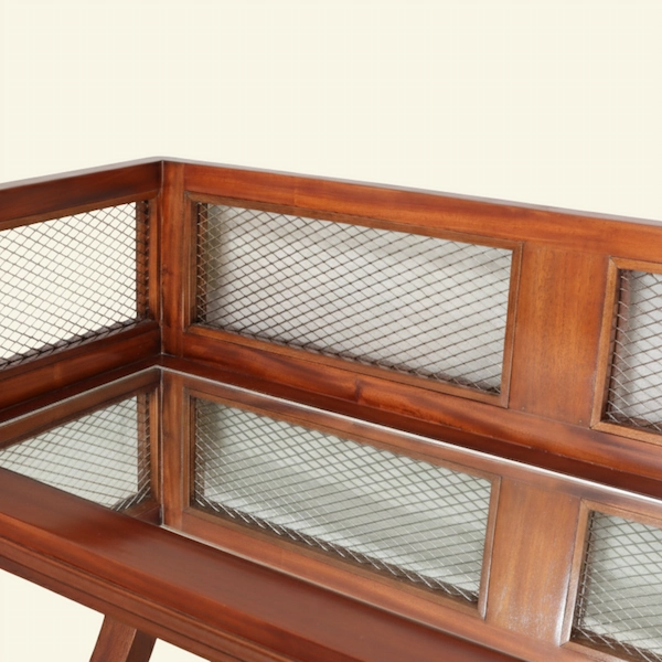 Madison Mahogany Cocktail Table Brass Mesh Panel Detail Closeup of mahogany cocktail table with brass mesh panel inserts and polished wood finish