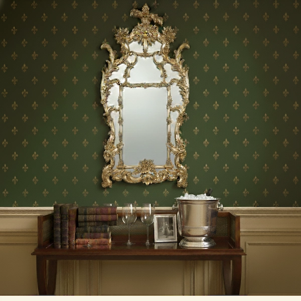 Madison Mahogany & Brass Cocktail Table in Styled Interior Styled living room with Madison Mahogany & Brass Cocktail Table decorated with books, wine glasses, and silver ice bucket under a gilded mirror