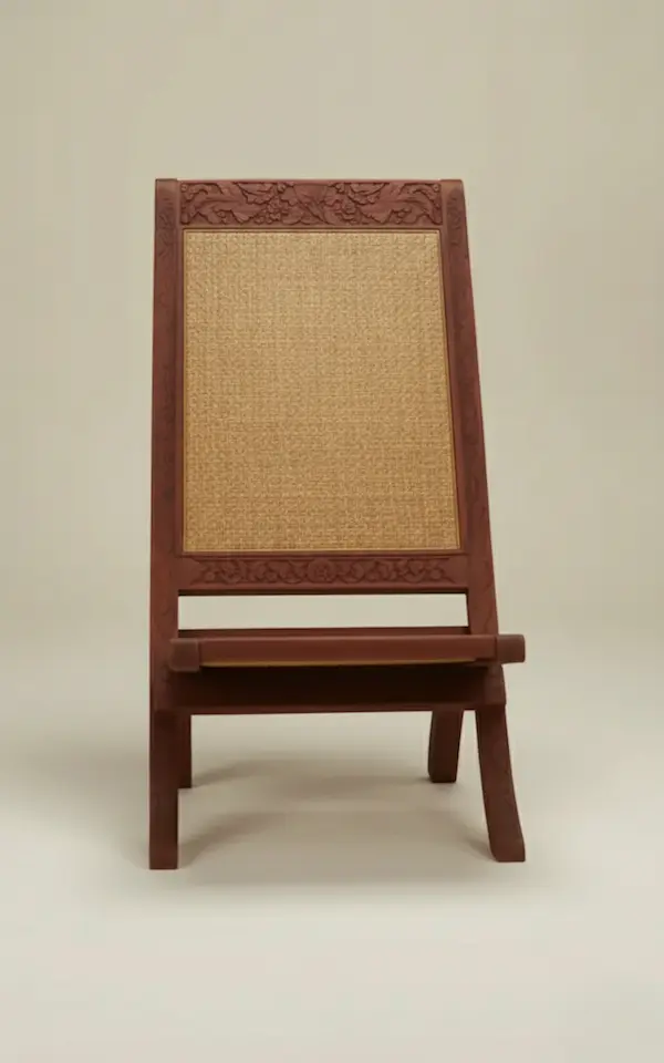 Front View – Maharaja Hand-Carved Folding Chair with Cane Seat Front view of Anglo-Indian Maharaja Hand-Carved Folding Chair in mahogany wood with woven cane seat and backrest