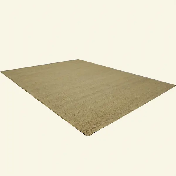 Angled view of Sandstone Brae Handwoven Jute Rug in warm sand tone