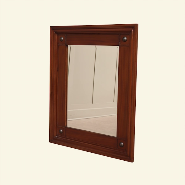 Equestrian Manor Mirror Angled Side View Angled view of the Equestrian Manor Mirror showing stepped mahogany frame and brass medallion accents.