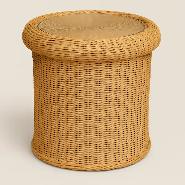 The Newport Wicker Side Table in handwoven natural wicker with a round silhouette