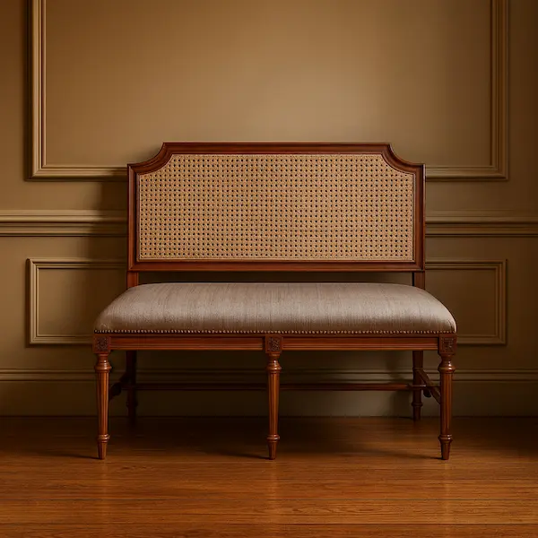 The Versailles Cane Settee – Lifestyle Setting Versailles Cane Settee styled in a traditional interior with warm lighting