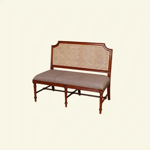 The Versailles Cane Settee – Angled Profile Angled view of the Versailles Cane Settee highlighting carved mahogany legs and cane back