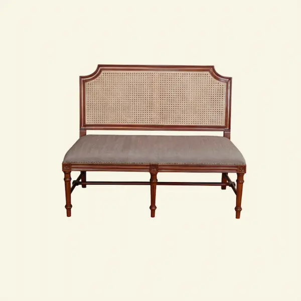 Versailles Cane Settee – Front View Versailles Cane Settee with handwoven cane back and upholstered seat in French Linen Ivory background