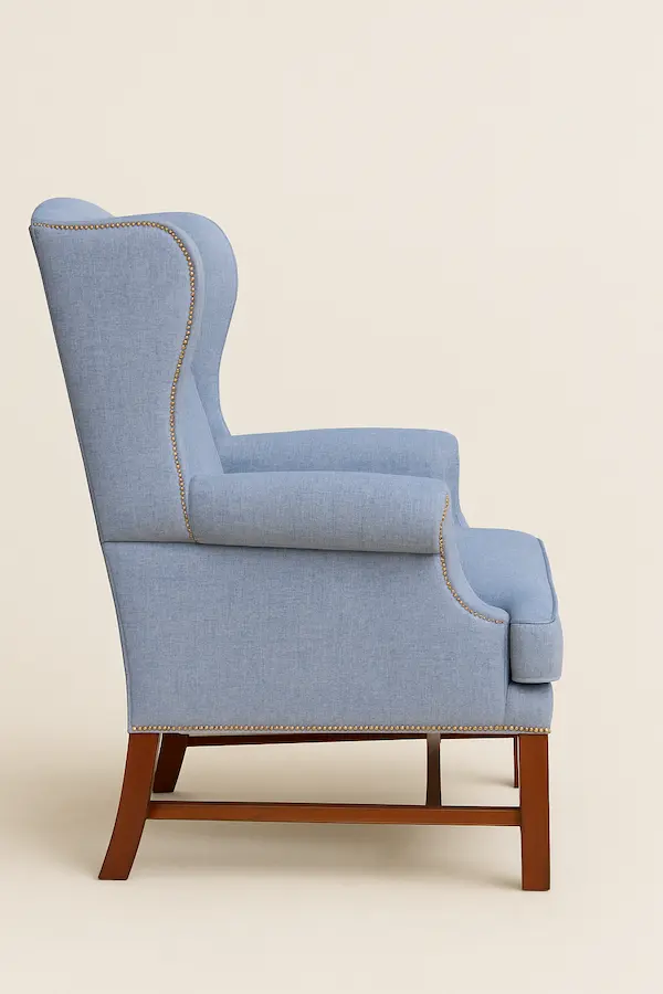 Wentworth Wingback Chair Side Profile – Reeva Sethi Home Wentworth Wingback Chair side view showing mahogany legs and wingback silhouette