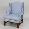 alt="Traditional wingback chair with classic proportions and upholstered wings"