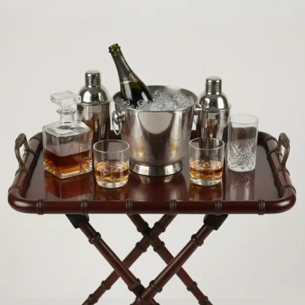 Windsor Faux Bamboo Butler’s Tray Table styled as a home bar with glassware and decanter