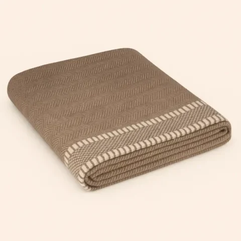 Highland Wool-Cotton Hemmed Throw folded neatly, taupe with cream hemmed edges, luxury wool-cotton blend.