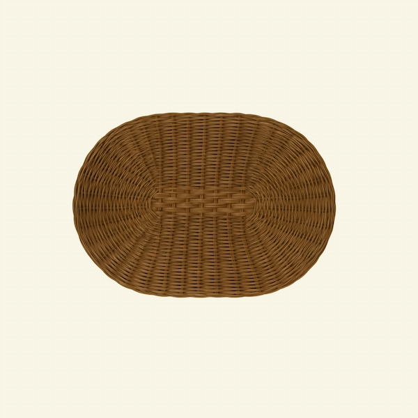 Oval Handwoven Rattan Placemat Brown oval rattan placemat on neutral background