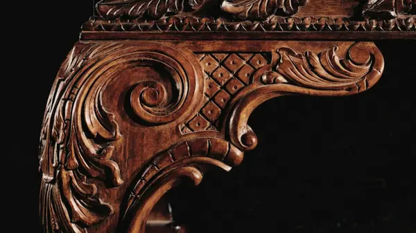 Close detail of hand-finished wood and natural fiber textiles