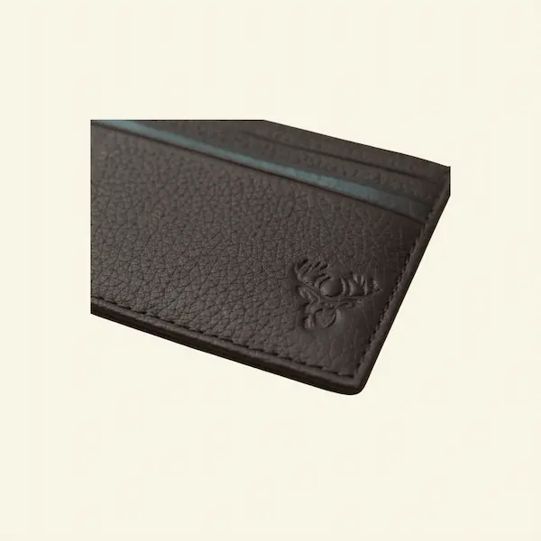 Stag Crest Pebbled Leather Card Case – Front View Stag Crest Pebbled Leather Card Case front close-up in mahogany pebbled leather