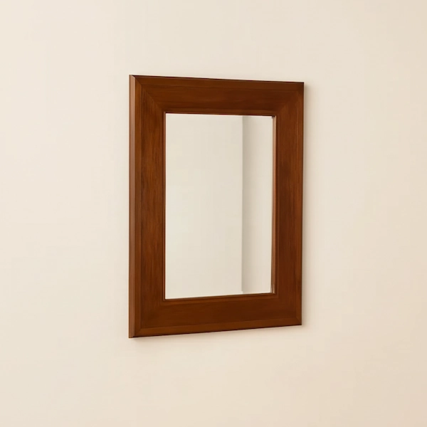 The Belgrave Mirror in polished mahogany with clean stepped frame, able to hang vertically or horizontally.