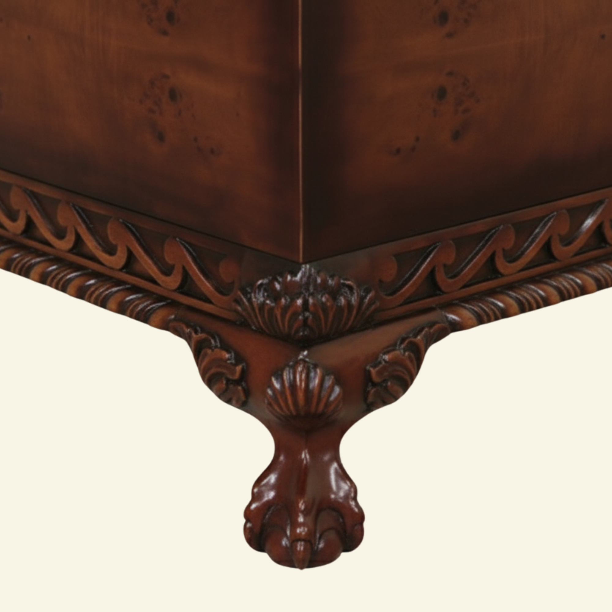 Dayton Coffee Table – Detail of Hand-Carved Apron and Brass Handle Close-up view of Dayton Coffee Table showing carved vine apron and antique brass drawer handle