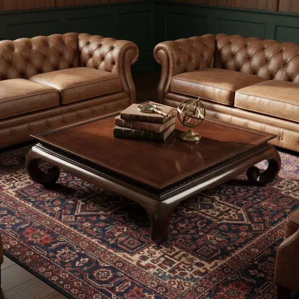 Imperial Scroll Coffee Table in Heritage Living Room Imperial Scroll Coffee Table styled with leather Chesterfield sofas and Persian rug in a heritage living room