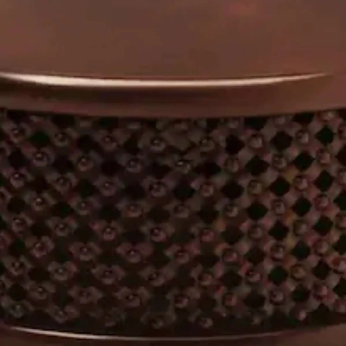 Close-up of the hand-carved openwork lattice on the Bamileke Drum Table in solid mahogany