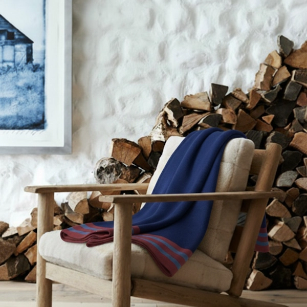 Oberon Jacquard cotton throw styled hearthside — heritage textile warmth in a contemporary interior