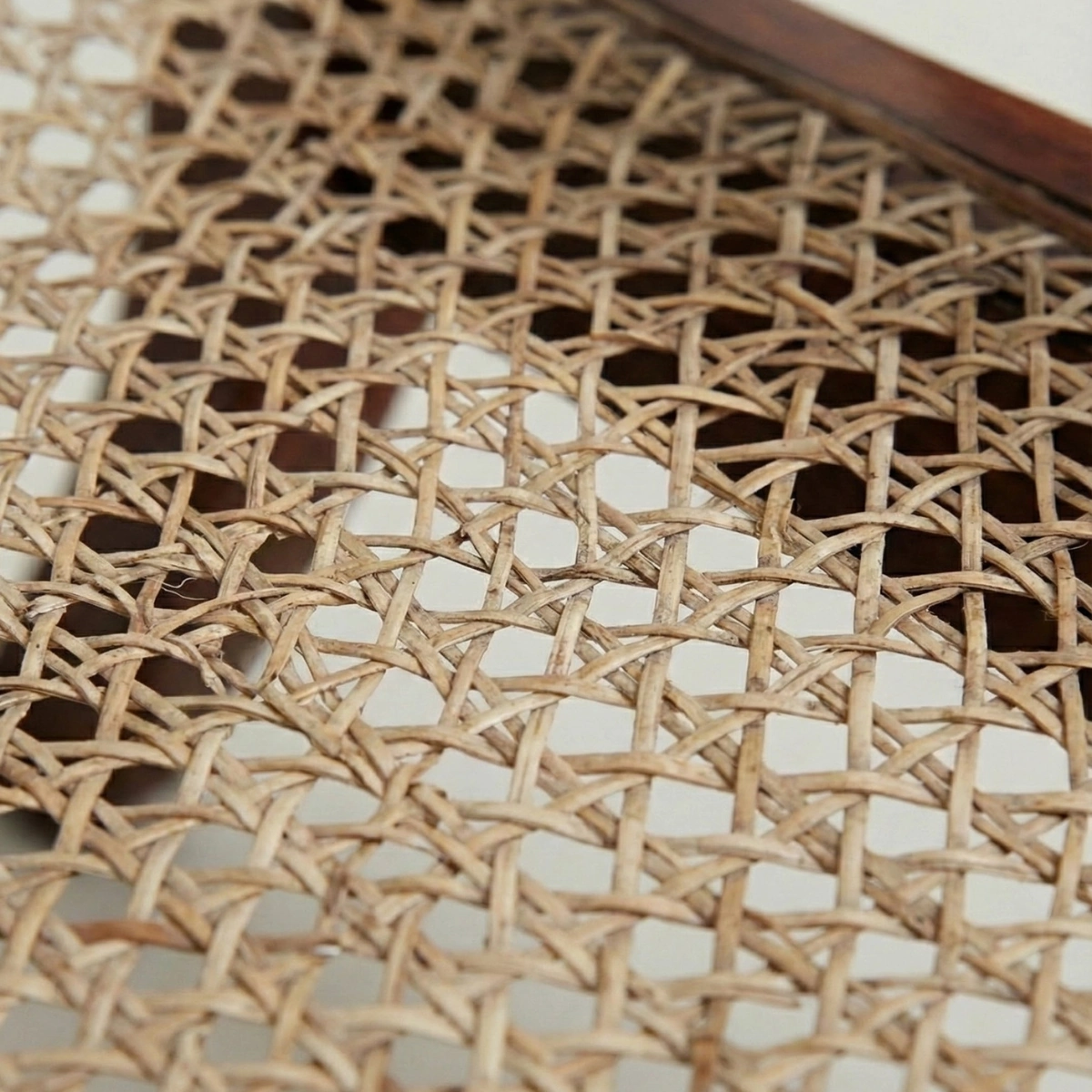 Close-up of hand-caned weave detail for quiet luxury home decor