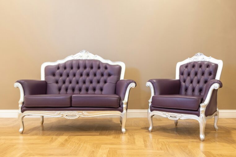 Classic leather club chairs featuring tufted upholstery and traditional construction