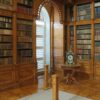 Elegant mahogany library bookcases filled with books in a traditional home setting