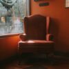 Classic leather club chair with rich patina in a traditional interior setting