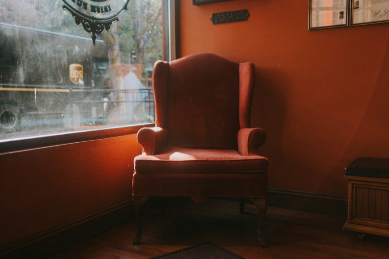 Classic leather club chair with rich patina in a traditional interior setting
