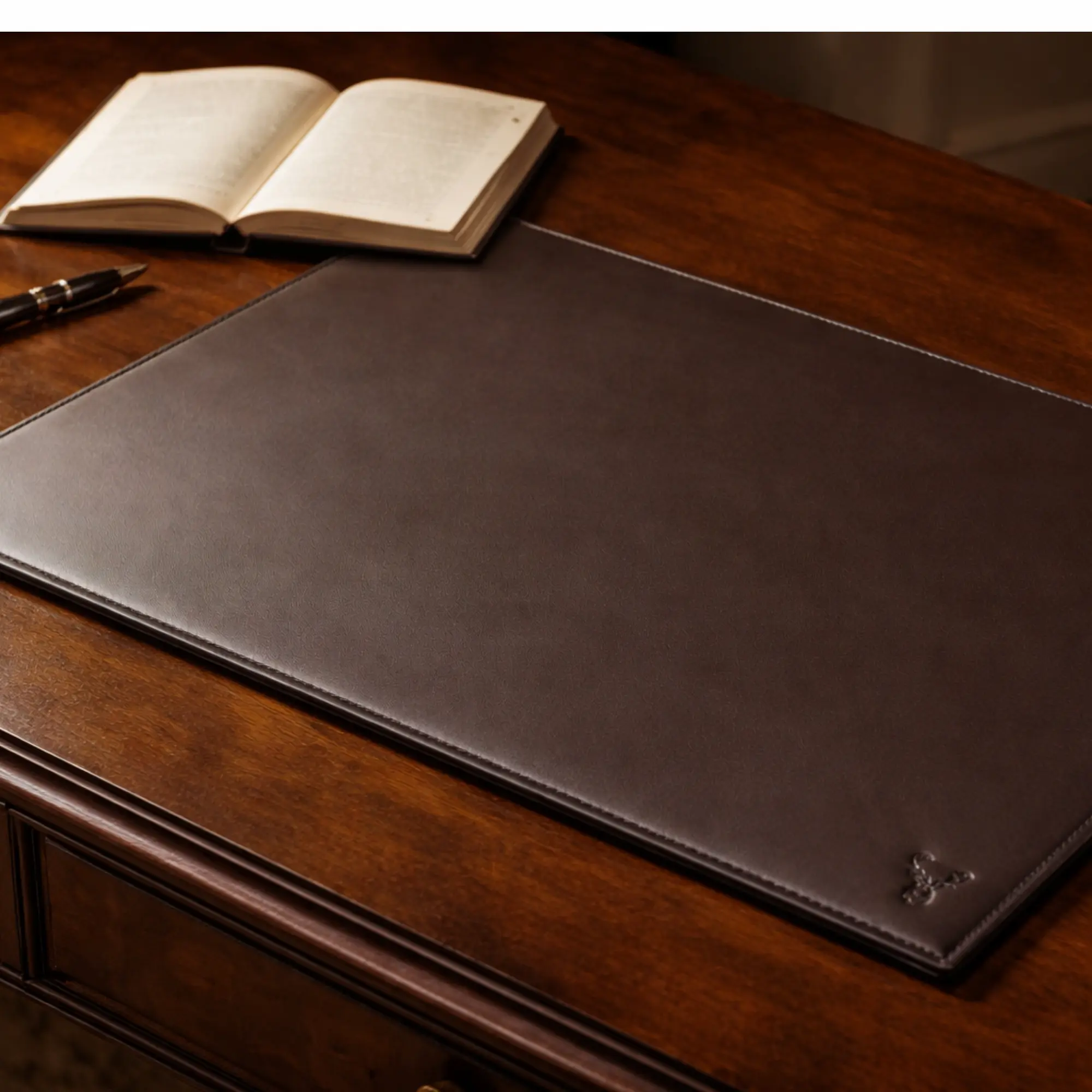 Ashbourne leather desk blotter styled on a wood writing desk