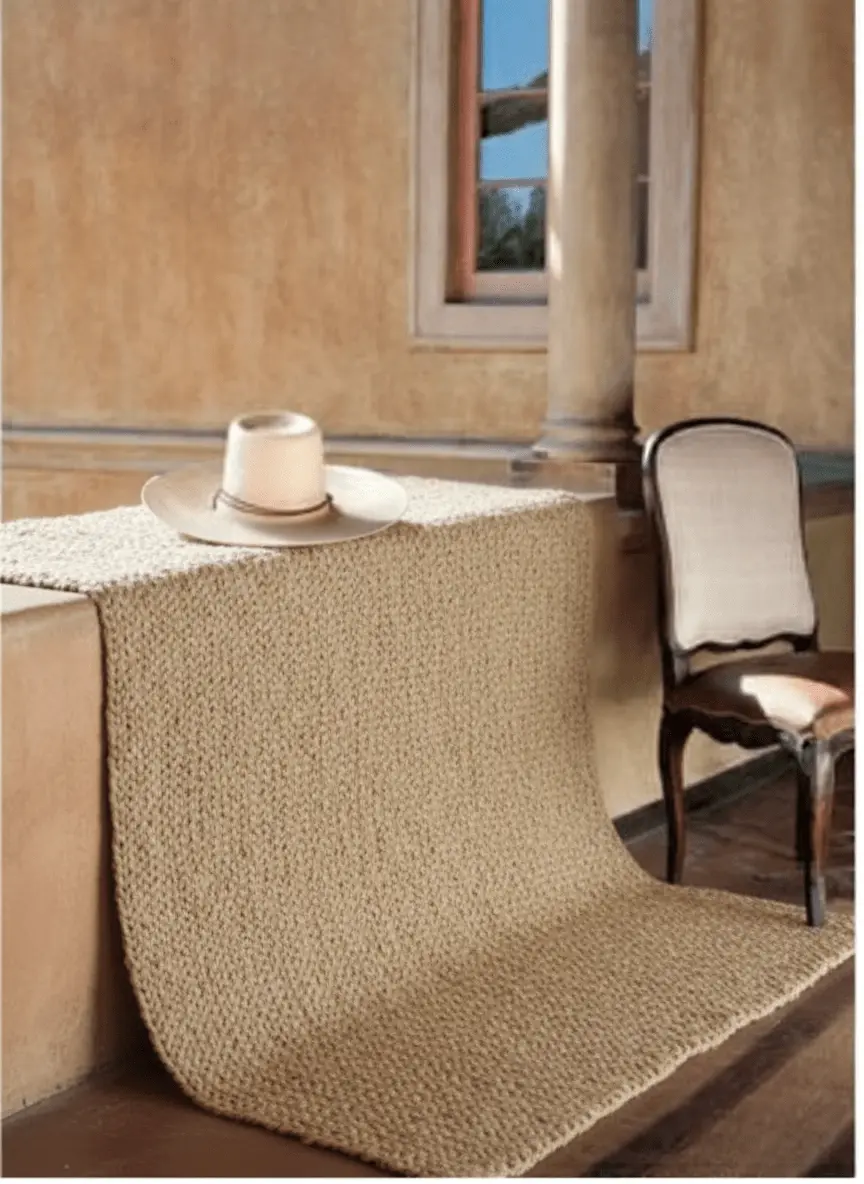 Hand-woven Coastal Grain jute rug styled in a sunlit Saratoga interior