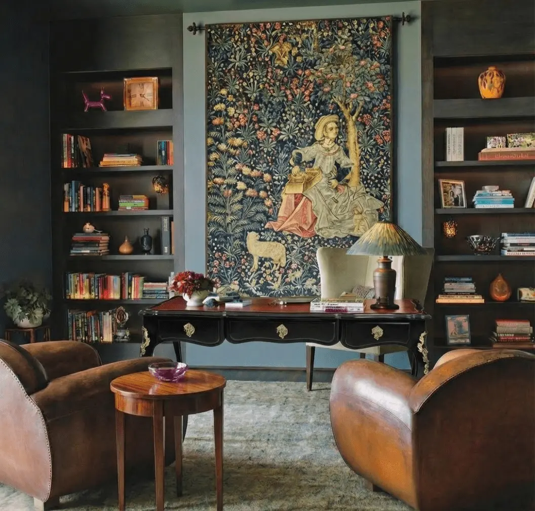 Library interior with antique tapestry anchoring the room and adding architectural gravity