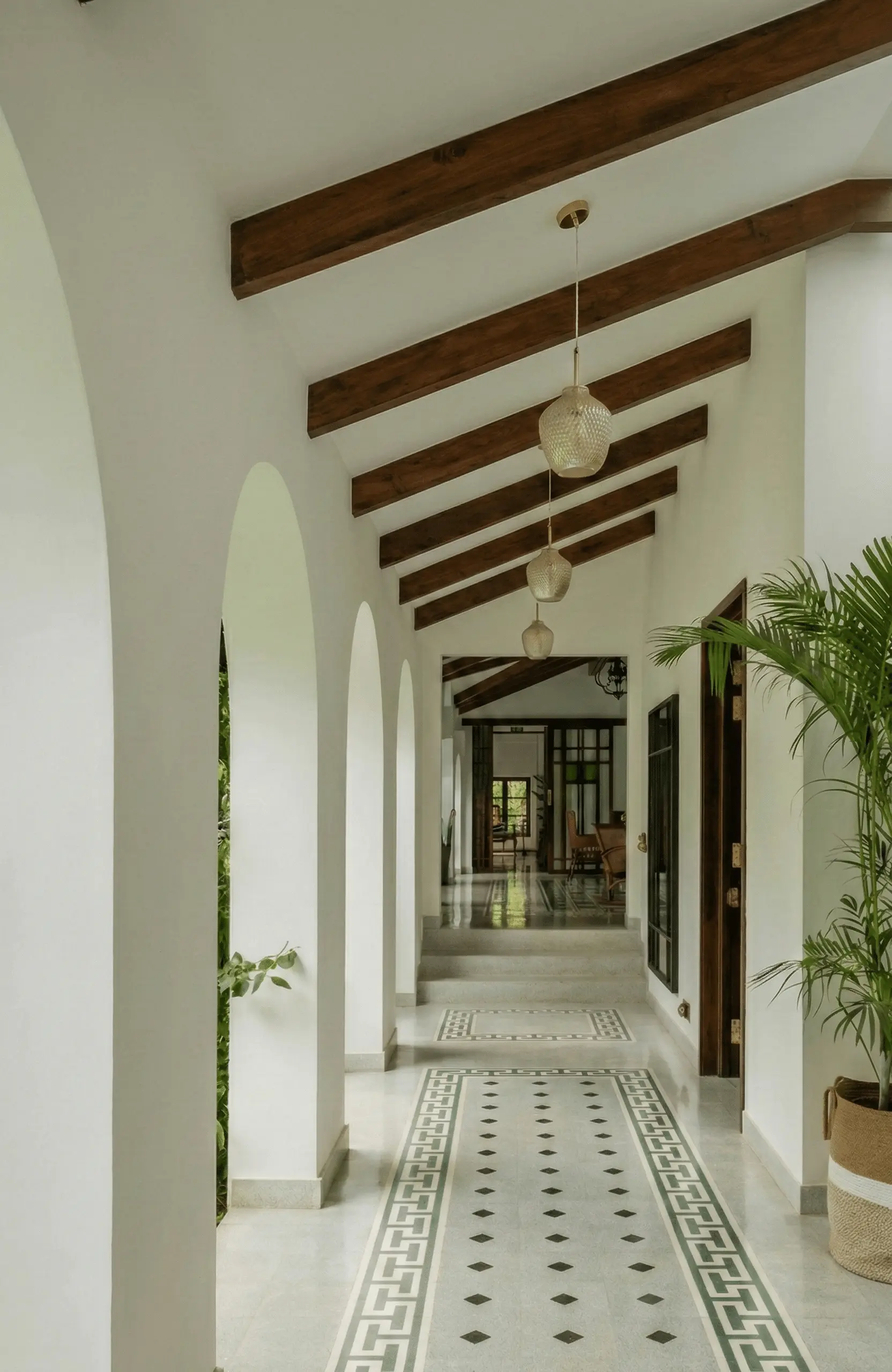 Arched corridor with proportioned scale — repetition and enclosure create calm