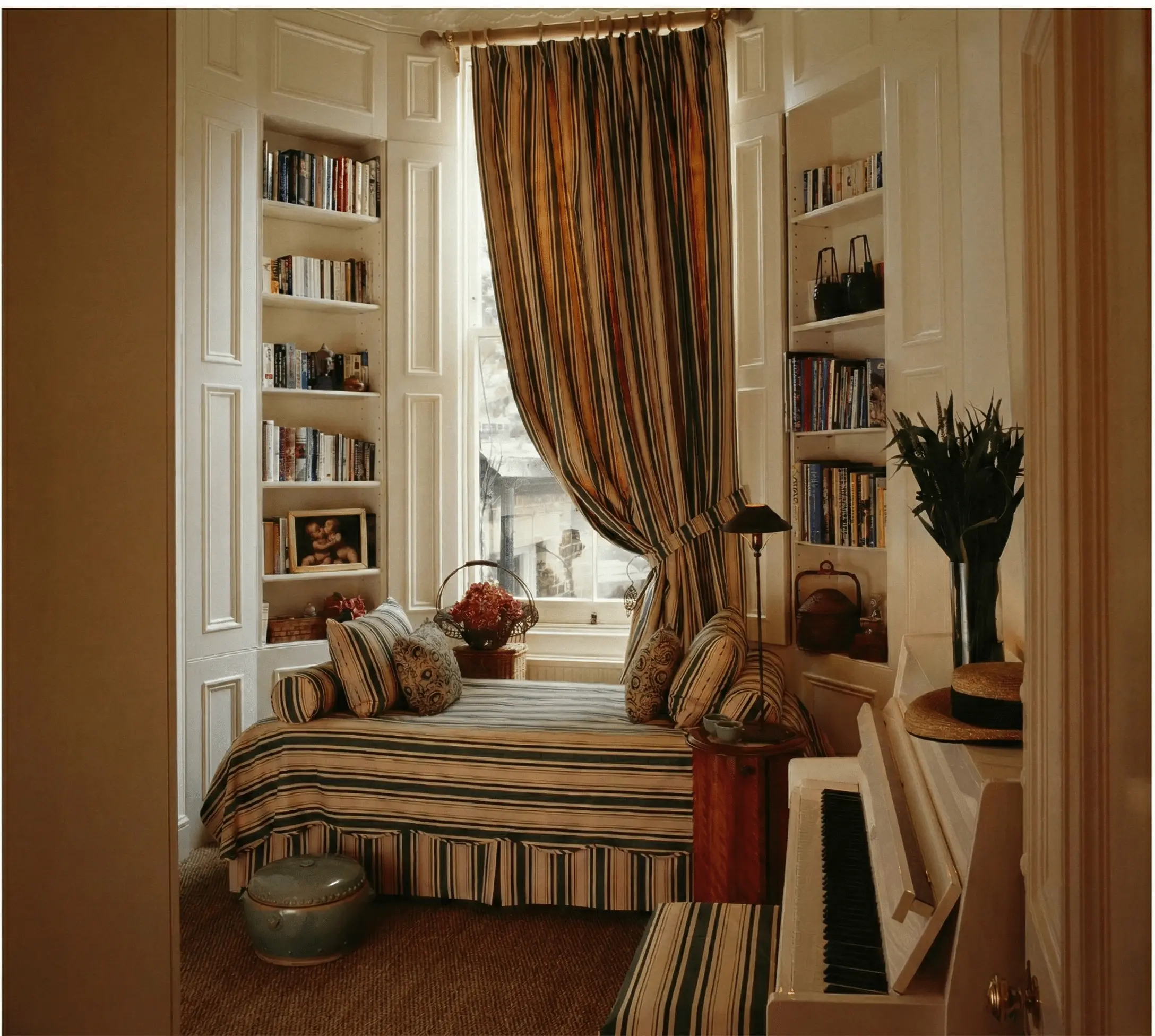 1990s London flat with disciplined palette and repeated stripe — continuity and restraint creating calm