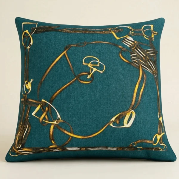 Equestrian decorative pillow with gold harness bit motif on teal fabric