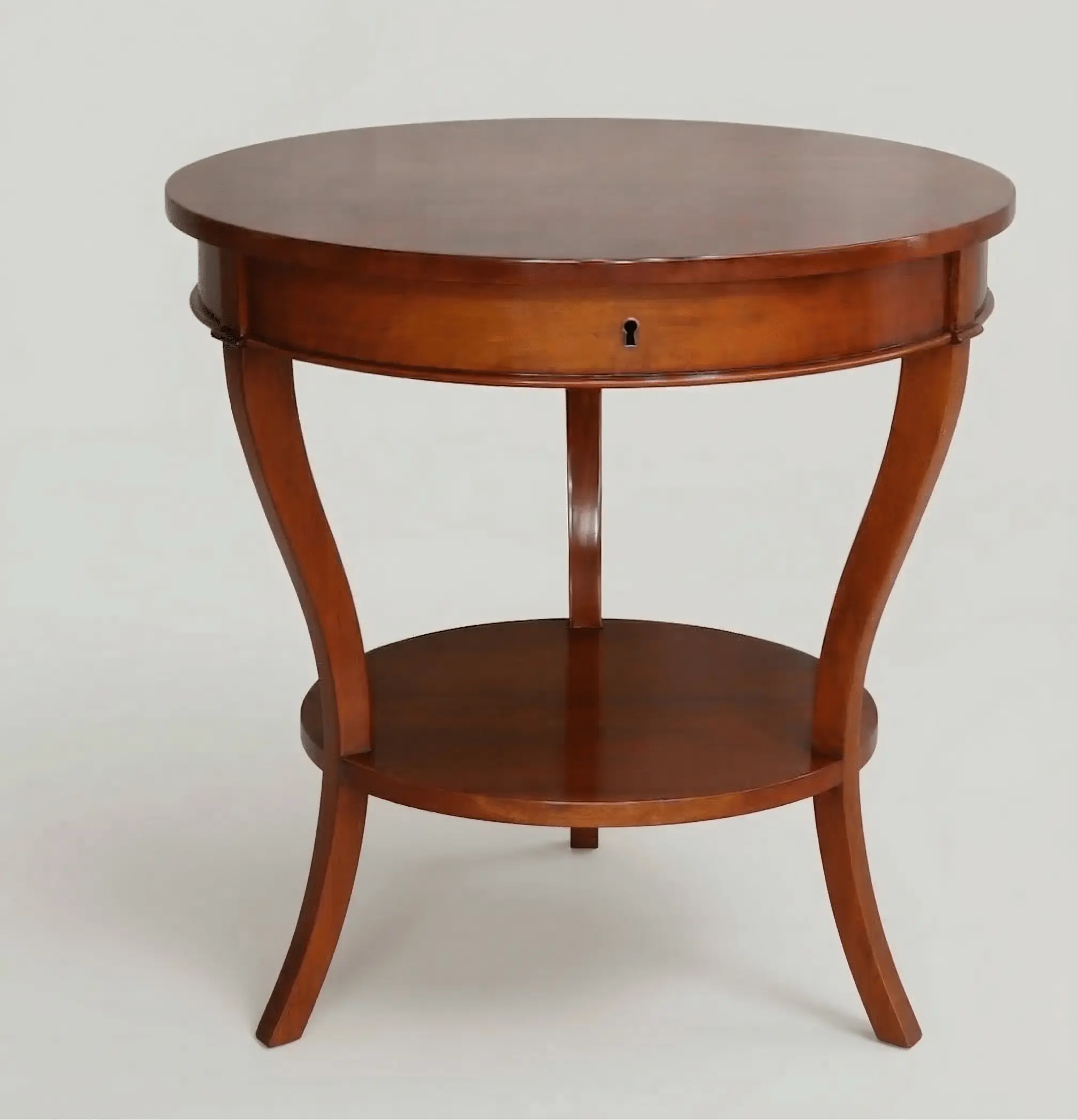 Round solid mahogany bedside table with drawer, sabre legs, and lower shelf