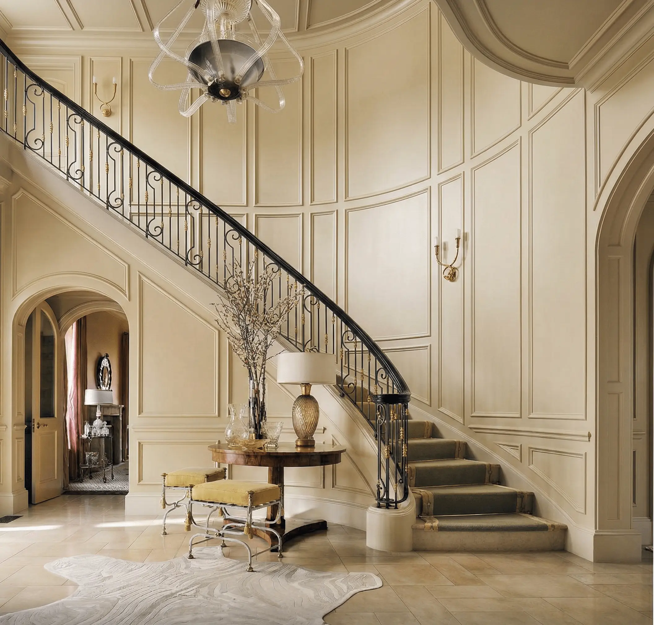 Classic threshold and stair hall with strong enclosure and layered light — the architecture of nostalgia