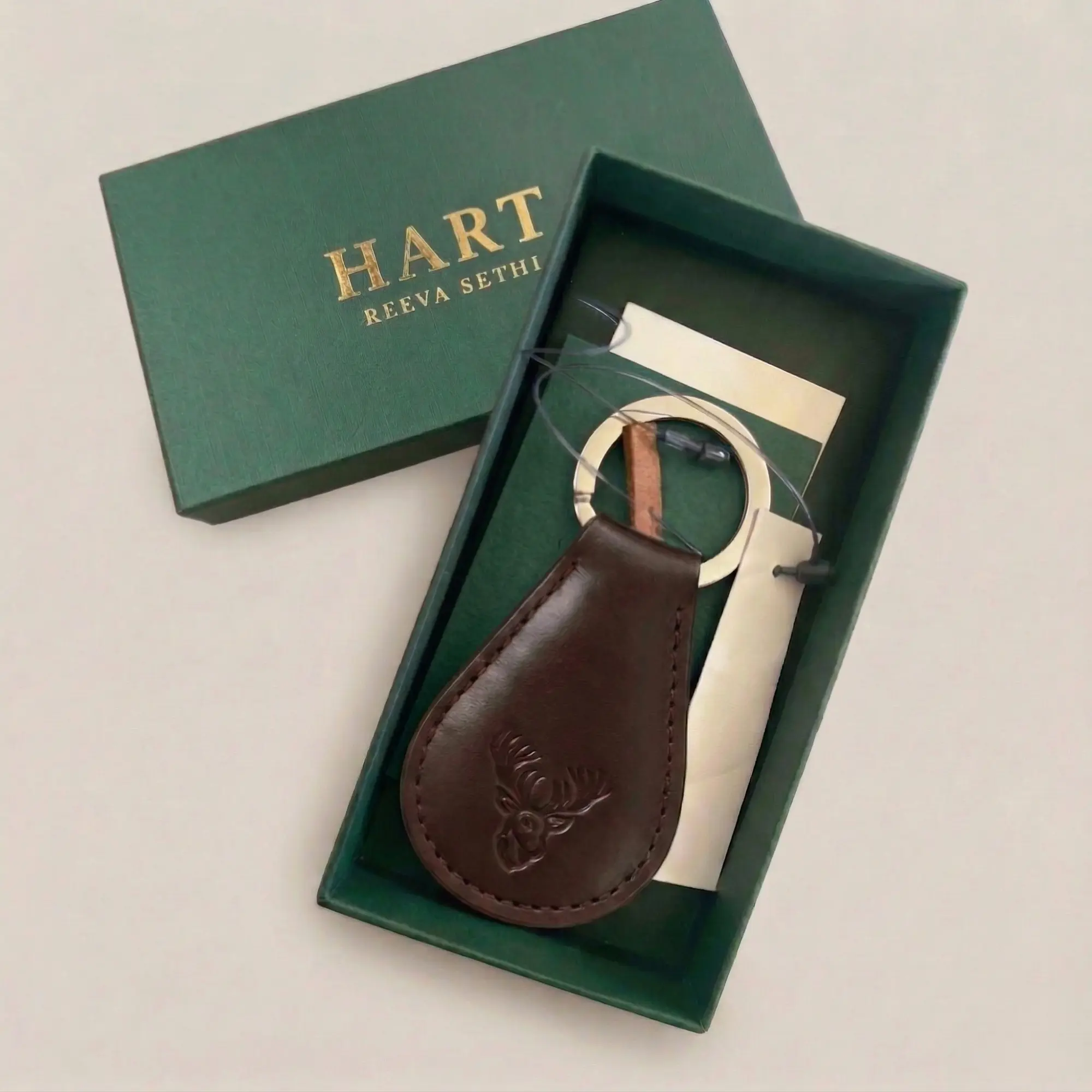Open gift box with leather keyring and packaging
