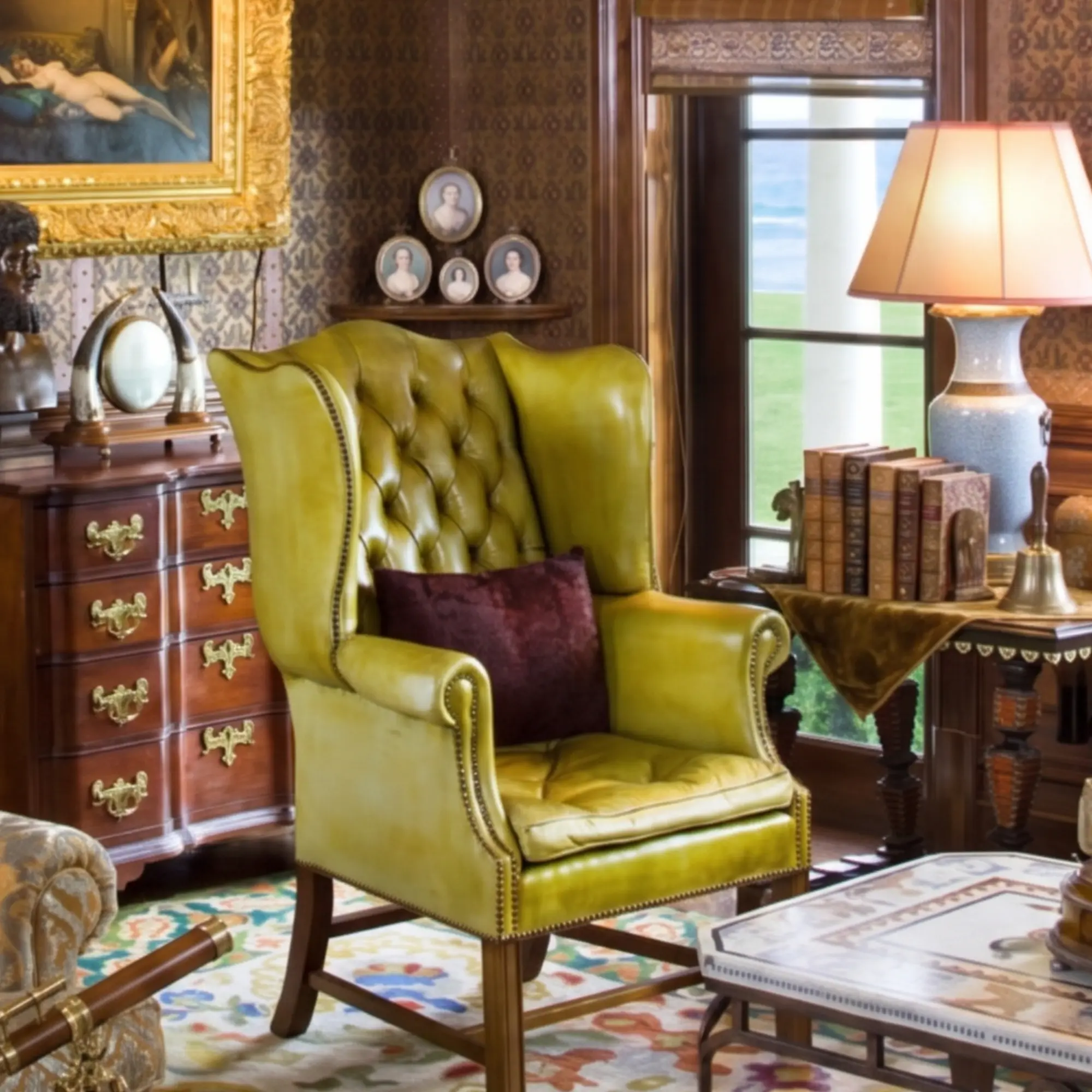 Traditional leather wingback chair with high back and enclosing side wings — the classic English silhouette built to shelter the sitter from draughts near the fire