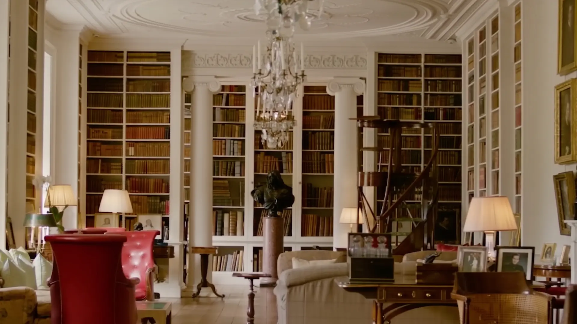 Collected interior with layered seating, books, natural materials, and warm light