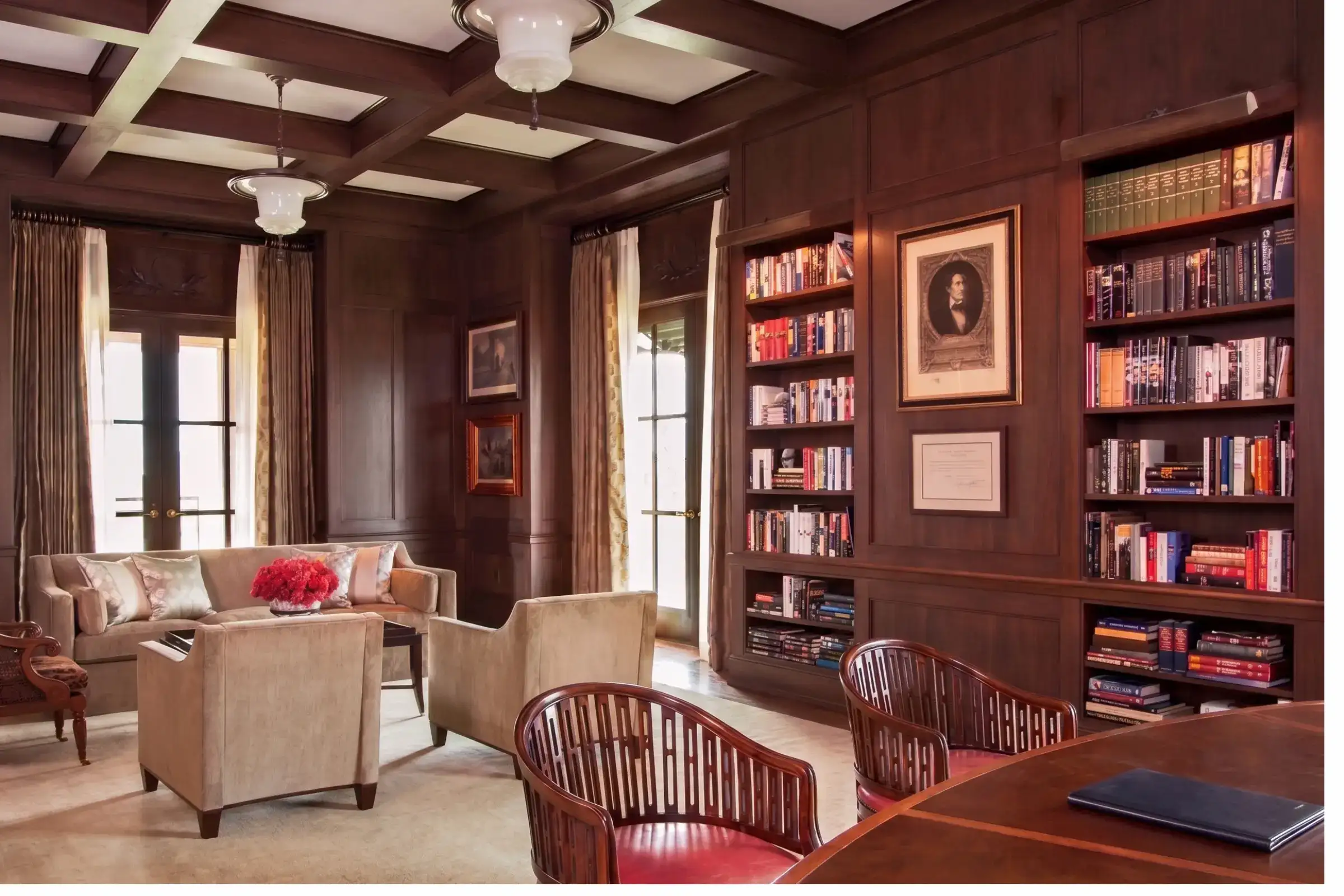 Dark wood library interior with walnut and mahogany shelving — modern heritage room from Reeva Sethi Home