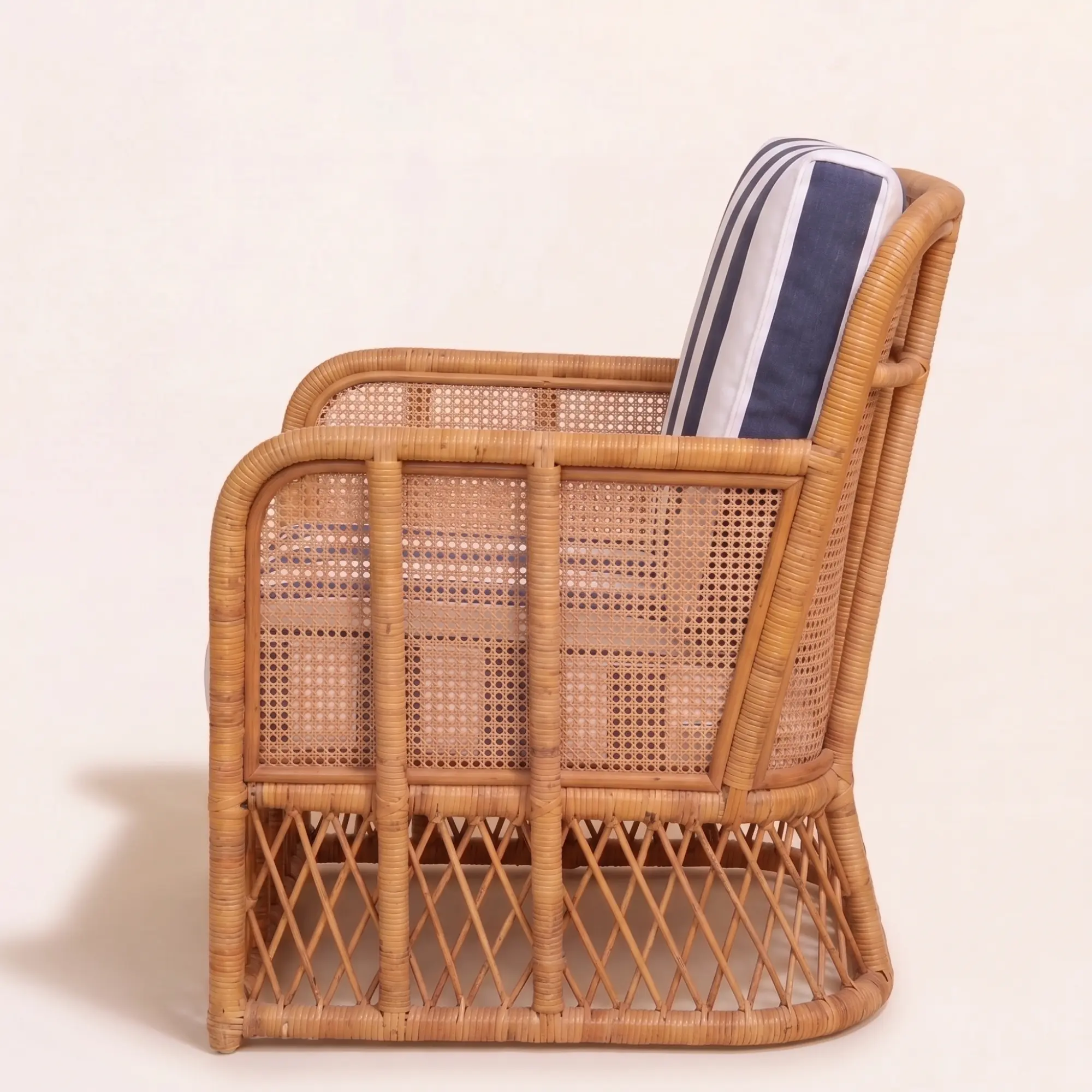 Montauk Cabana Lounge Chair 5 Left side profile of Montauk Cabana Lounge Chair featuring handwoven rattan construction