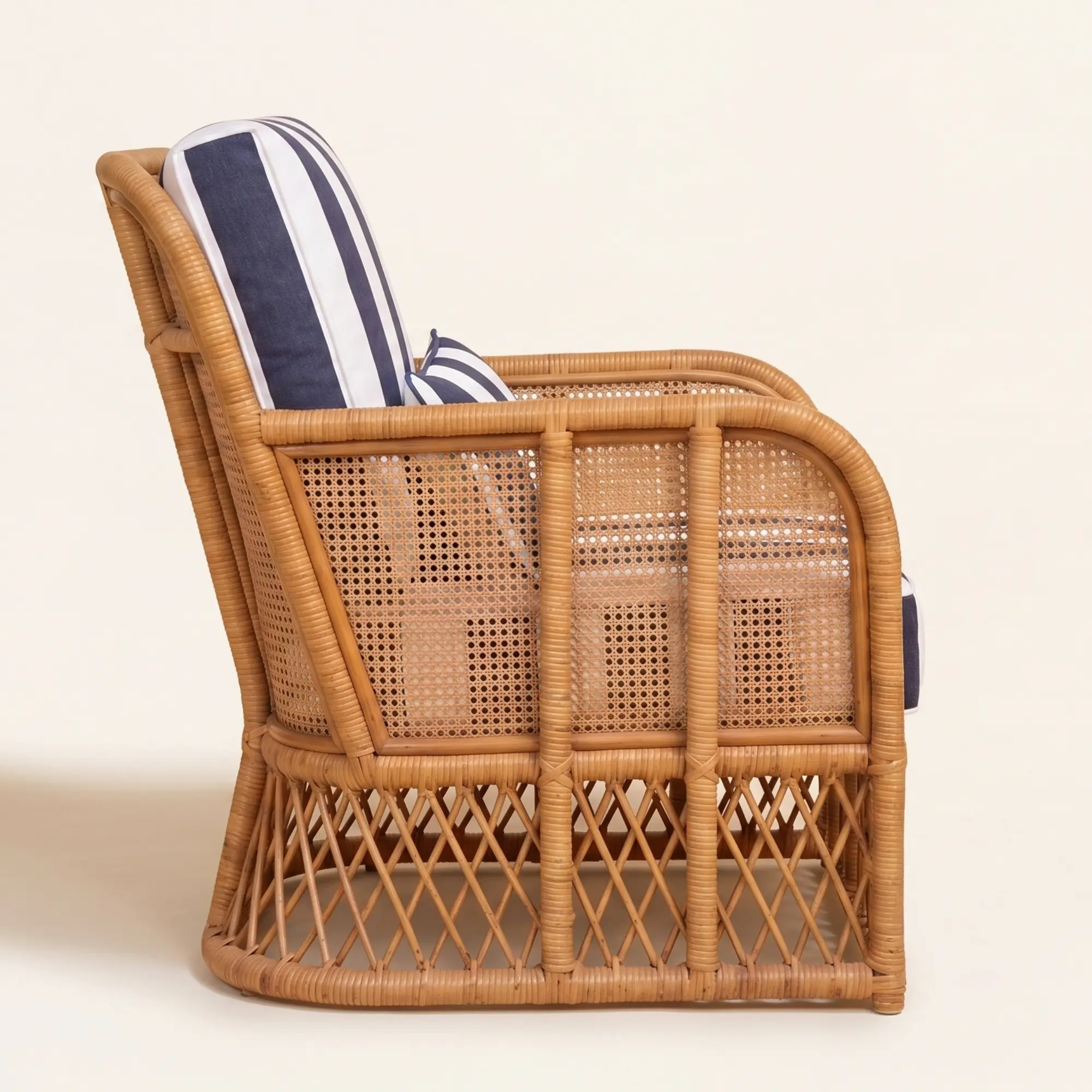 Montauk Cabana Lounge Chair 4 Right side profile of Montauk Cabana Lounge Chair with woven cane frame and striped upholstery