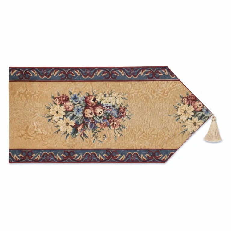 Festival Flowers jacquard table runner in golden ochre with cream daisies, dusty pink roses and cornflower blue, cranberry and slate border, cream tassel at the pointed end