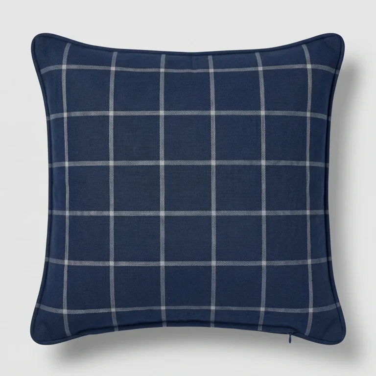 Square navy pillow cover with an evenly spaced white windowpane check and navy piped edge