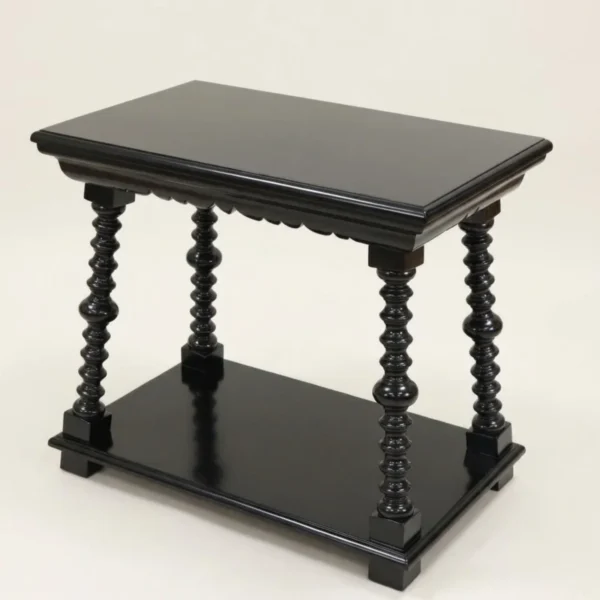 Hudson River Valley Table in black lacquer with bobbin-turned legs, a scalloped apron and a lower shelf on block feet, three-quarter view