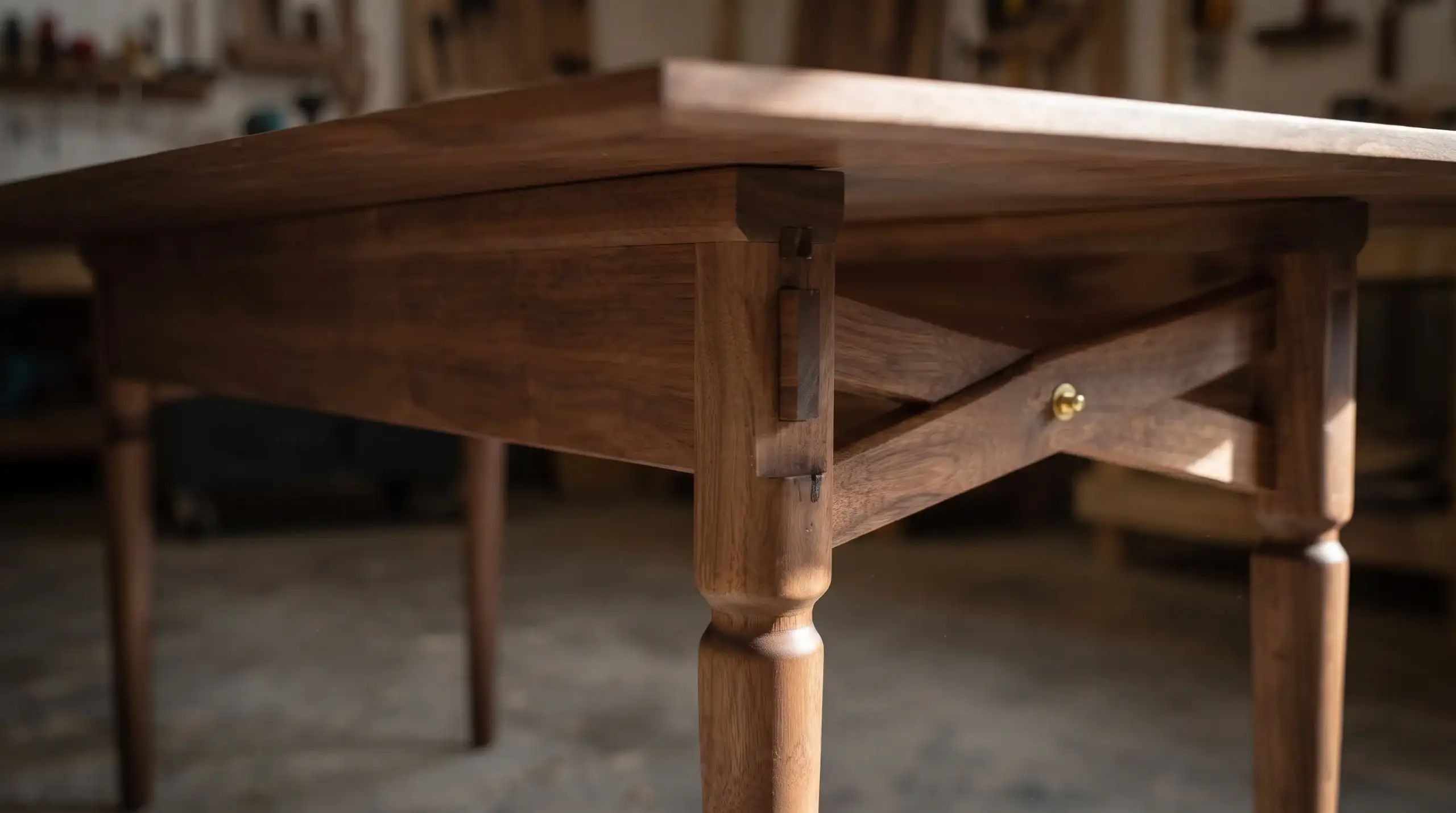 How to Tell If Furniture Is Well Made | A Field Guide to Craftsmanship 3 Solid wood dining table underside showing mortise-and-tenon joinery, a stretcher frame, and turned legs