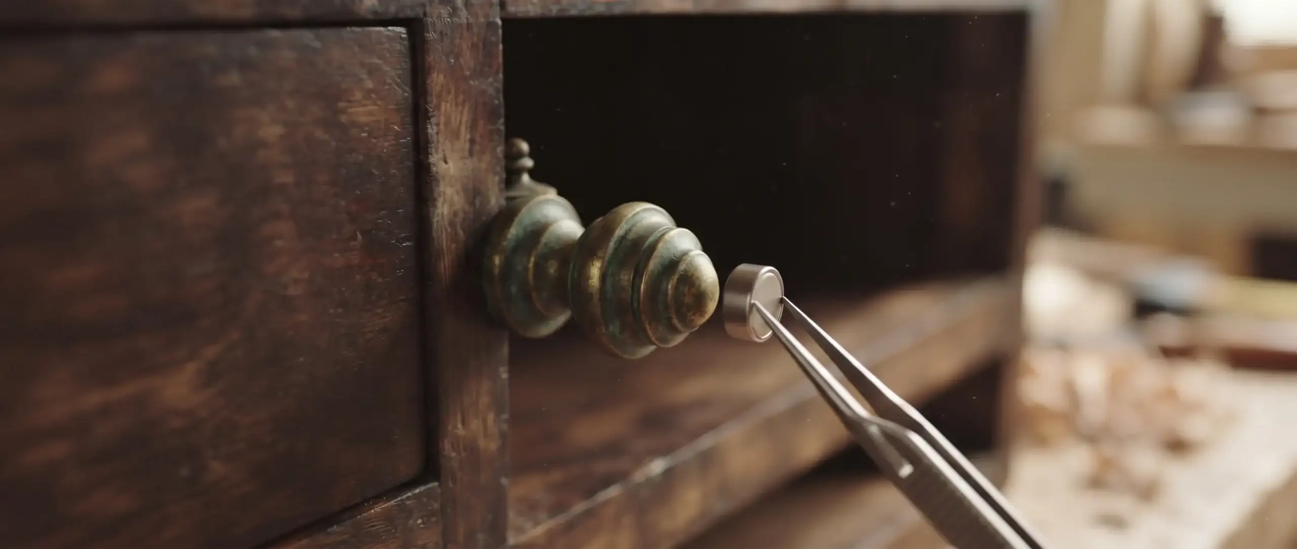 How to Tell If Furniture Is Well Made | A Field Guide to Craftsmanship 6 Magnet held near an aged solid brass furniture knob without attaching to it